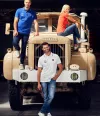 3 people presenting merchandising on a Berliet truck